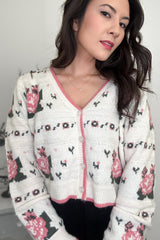 Woman wearing a vintage inspired pink floral cardigan